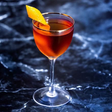 Manhattan Cocktail garnished with a cherry