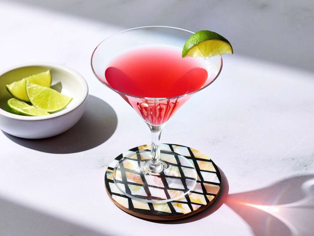 Cosmopolitan cocktail with lime twist garnish