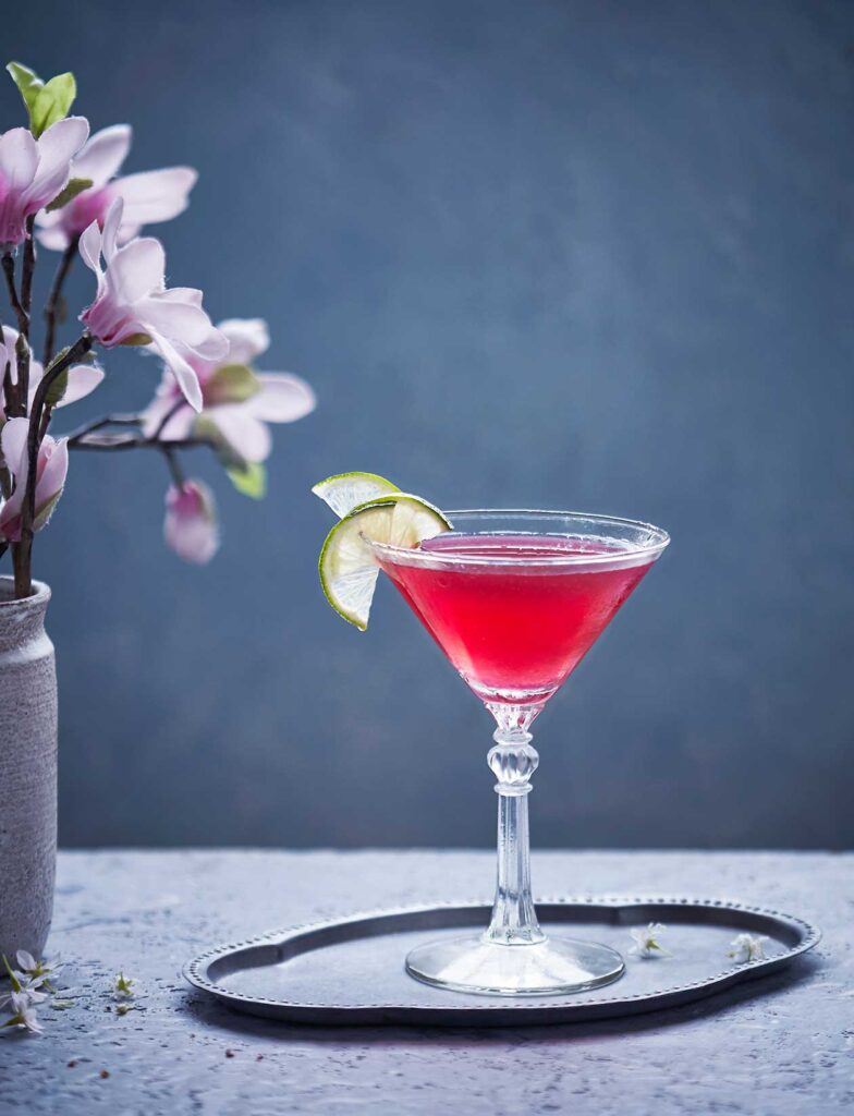 Cosmopolitan cocktail with lime twist garnish