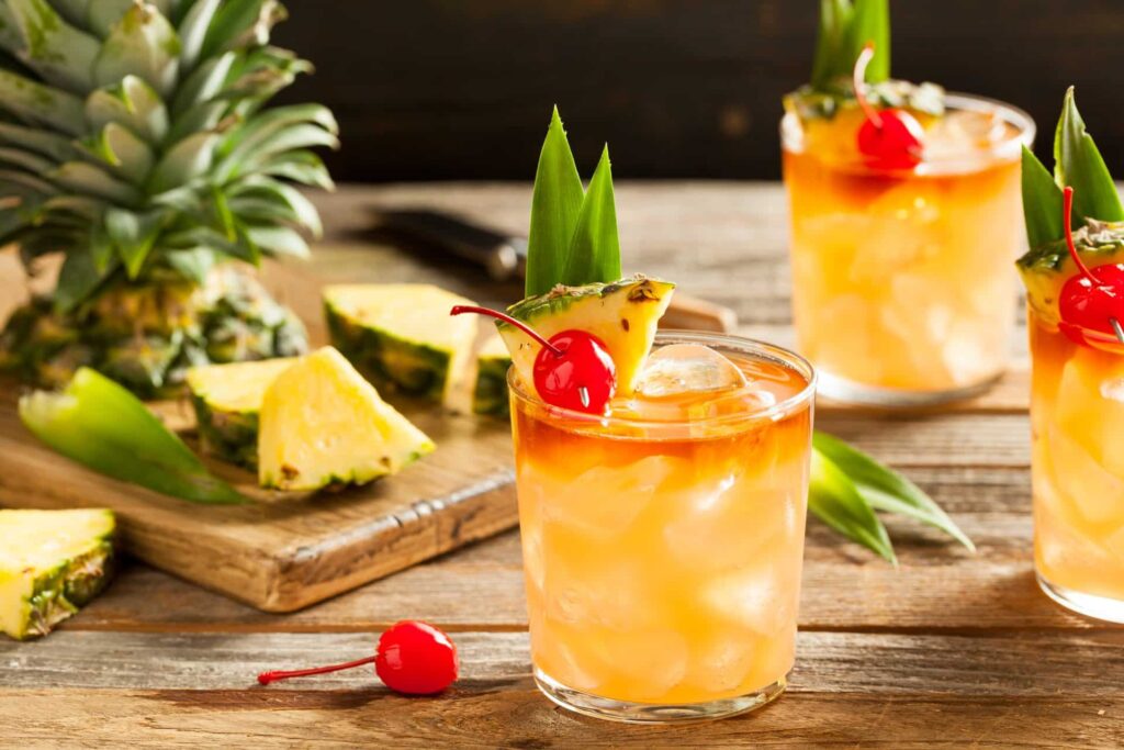 Mai Tai cocktail in tiki glass with mint and lime garnish