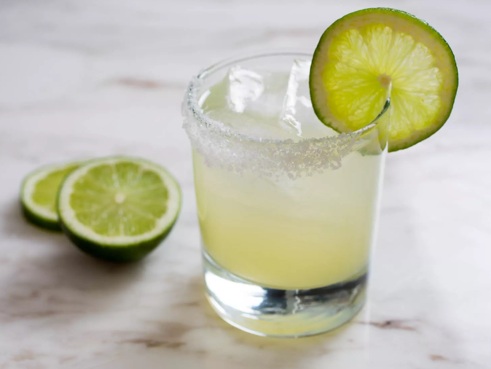 Classic Margarita cocktail with lime and salt rim