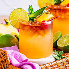 Mai Tai cocktail in tiki glass with mint and lime garnish