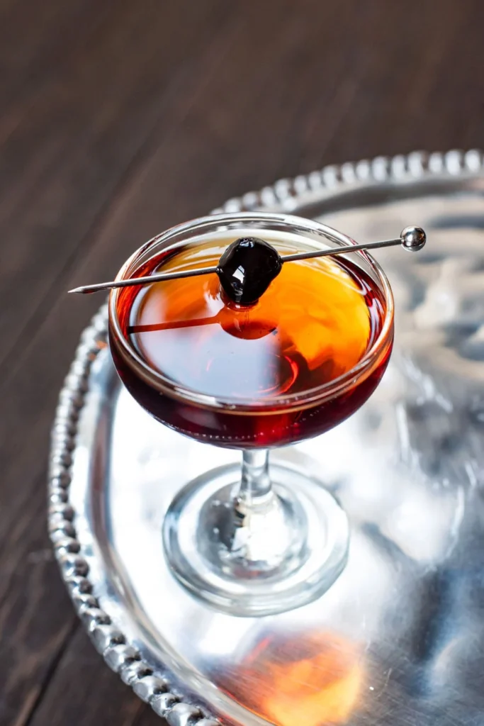 Manhattan Cocktail garnished with a cherry