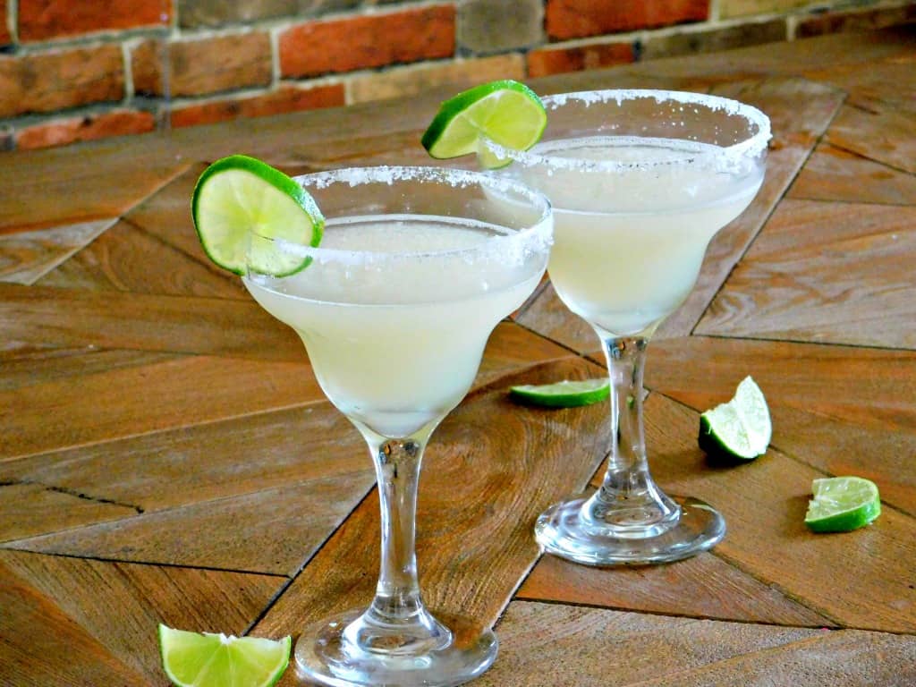 Classic Margarita cocktail with lime and salt rim
