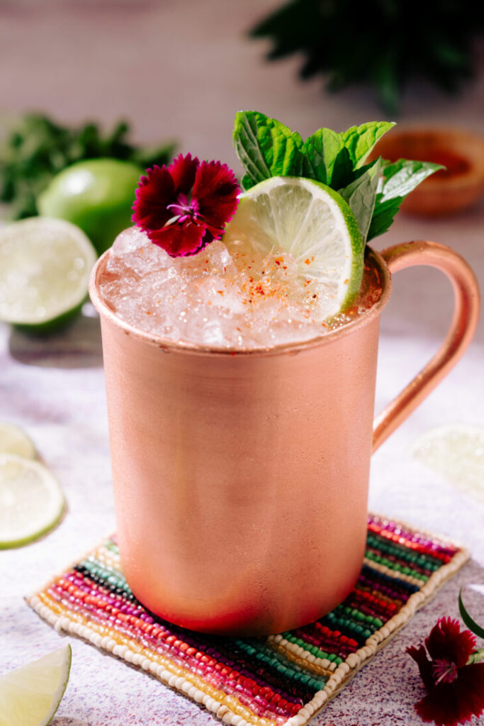 Moscow Mule cocktail served in a copper mug with lime garnish