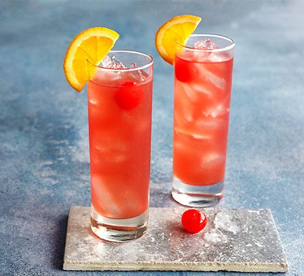 Sex on the Beach cocktail with orange slice garnish