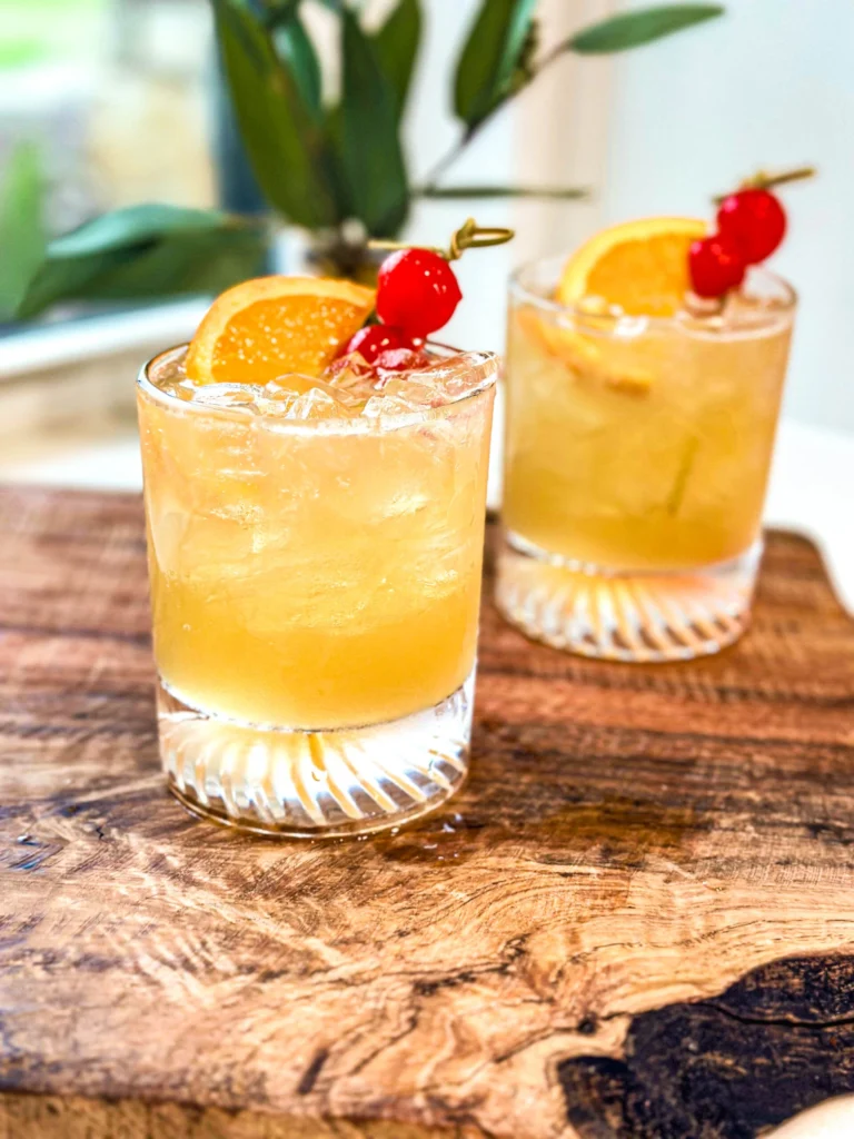 Classic Whiskey Sour cocktail in rocks glass with lemon garnish