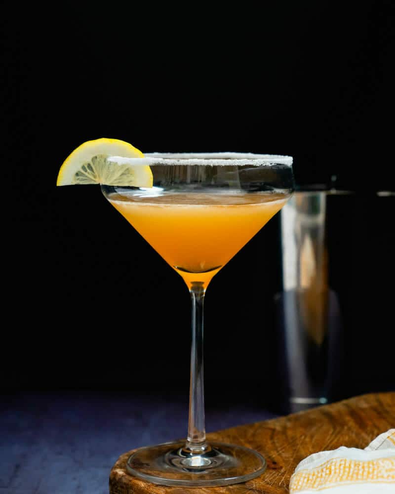 Sidecar cocktail served in a classic coupe glass with a lemon twist
