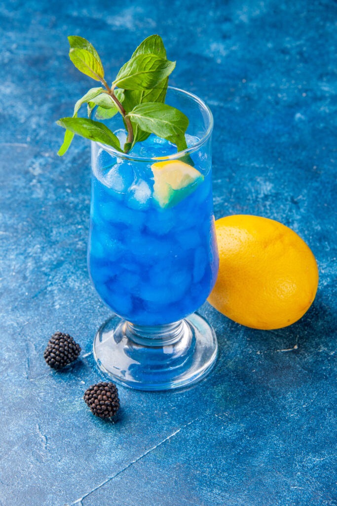 Blue Lagoon cocktail with lemon garnish