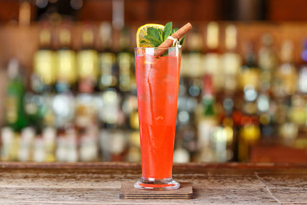 Singapore Sling cocktail with cherry and pineapple garnish