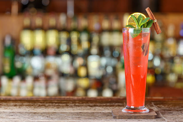 Singapore Sling cocktail with cherry and pineapple garnish
