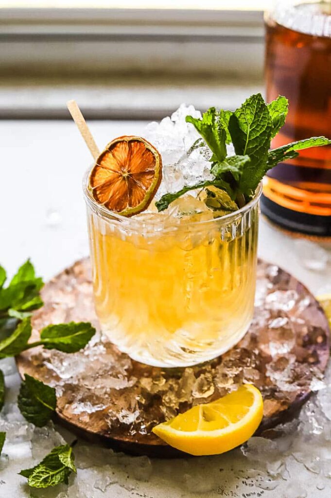 mint julep cocktail served in a silver cup with mint garnish